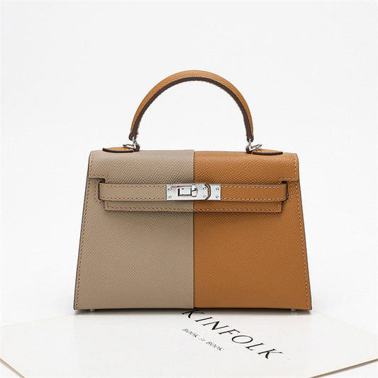 Sophisticated crossbody and shoulder bag in Kelly style, made from real leather with a polished, structured finish.

