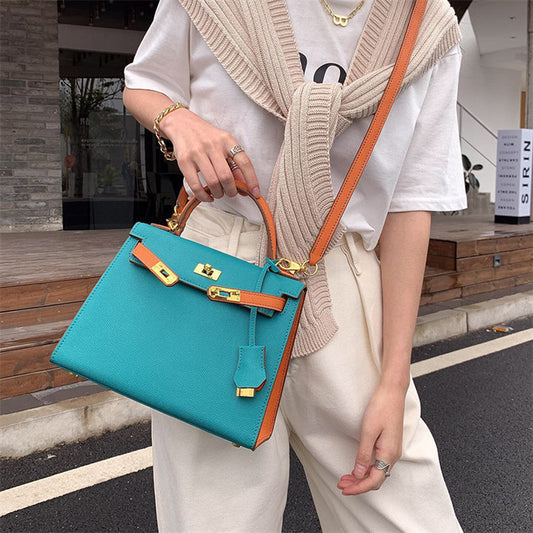 Kelly-style genuine leather crossbody and shoulder bag with gold hardware, structured design, and adjustable strap, elegant and versatile for women.
