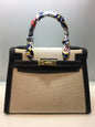 Stylish Kelly-inspired handbag with leather build, structured body, and multipurpose strap for everyday sophistication.

