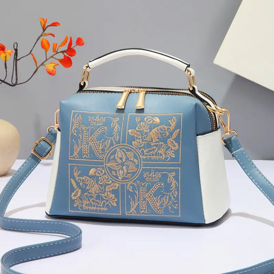 Elegant large women's handbag with crossbody and shoulder strap design, crafted for high-end fashion appeal."